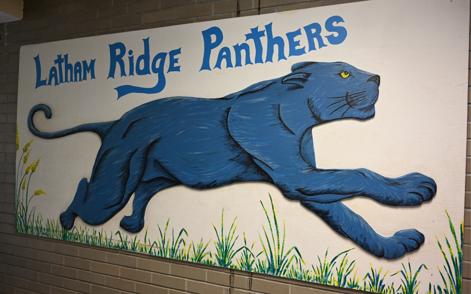 Elementary School student gets his hand painted during classroom art activity.