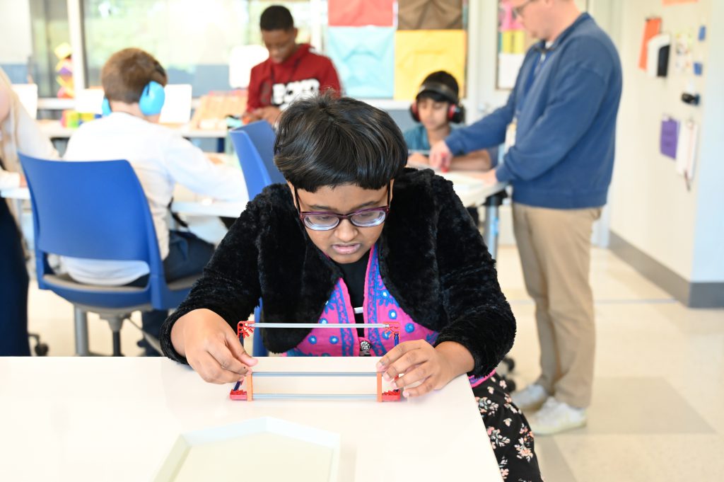 An image of a student working intently on an assignment.