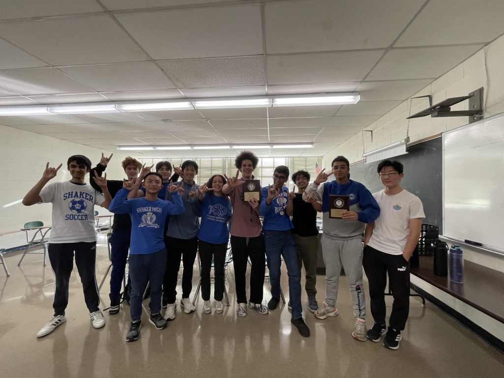 An image of a group of students holding the plaques they won competing in the CNY History Bowl & Bee.