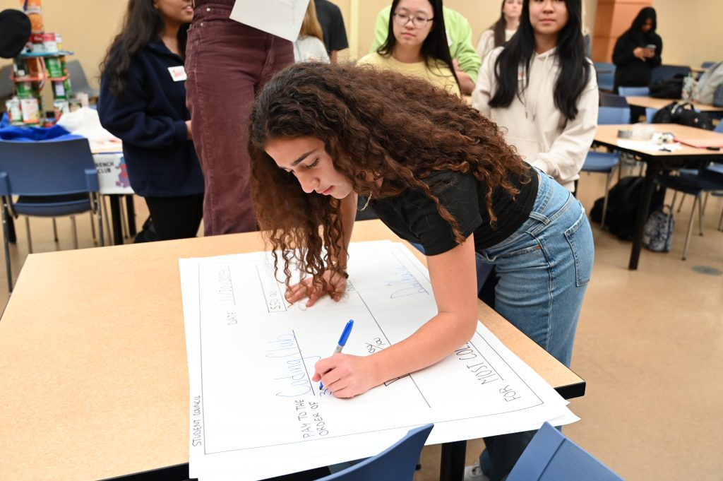 Student signing award