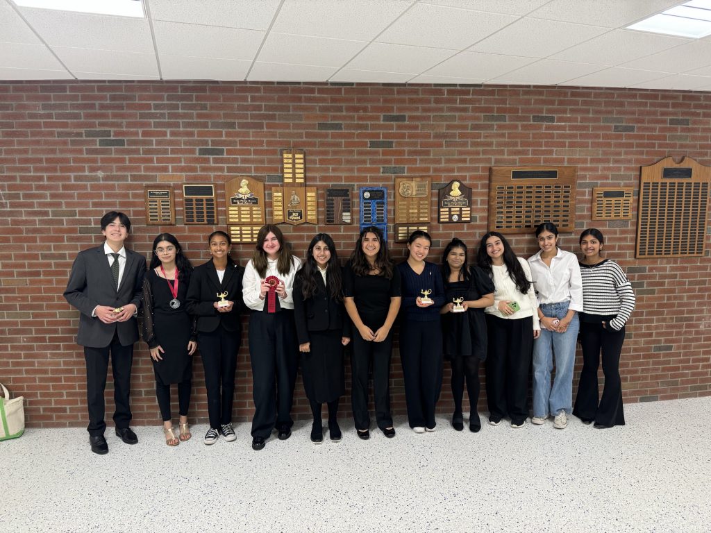 An image of eleven students who make up Shaker High School's Speech & Debate team.