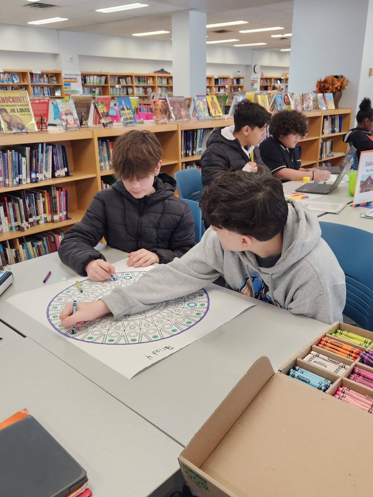 An image of two students coloring mandalas.