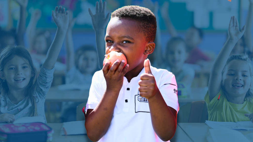 This is an image of a boy holding an apple.