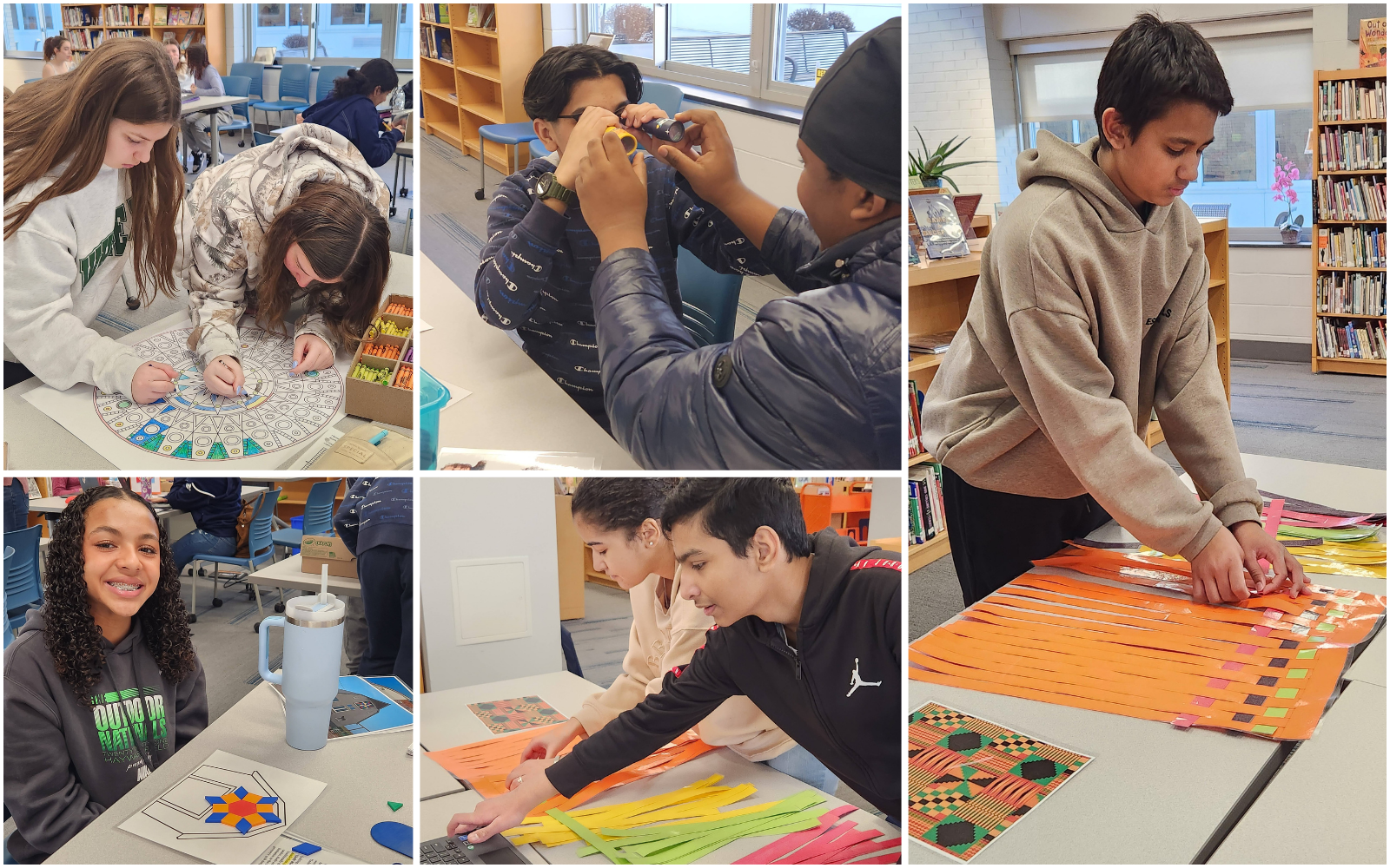 Elementary School student gets his hand painted during classroom art activity.