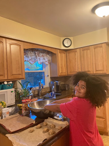 An image of a child mixing something in a bowl.