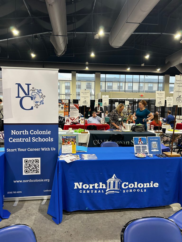 An image of a table and banner labeled "North Colonie Central Schools."