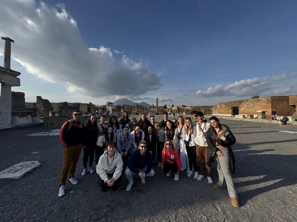 An image of students touring ancient ruins in Italy.