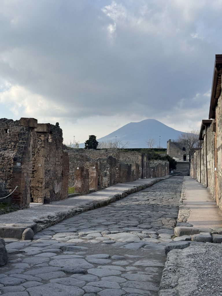 An image of a stone path along ancient ruins in Italy.